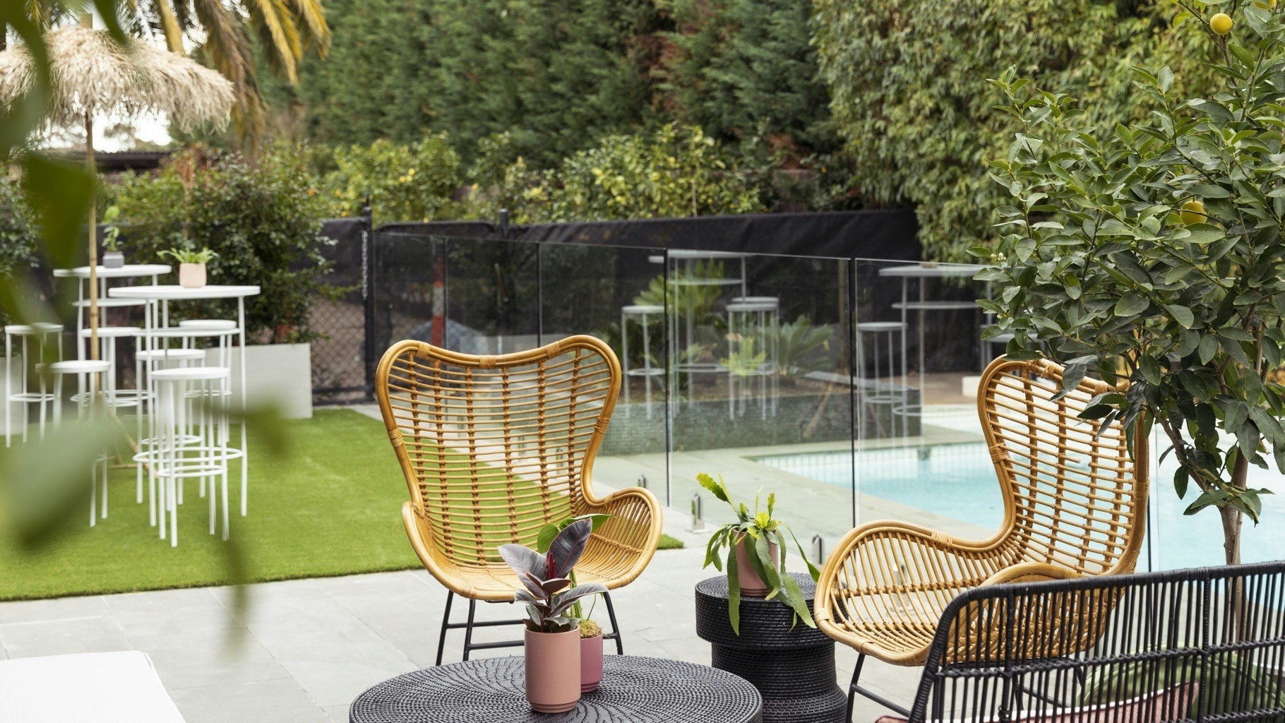 Sitting area with chairs and decorative pool.
